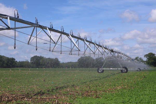 irrigation scaffolding above a green field