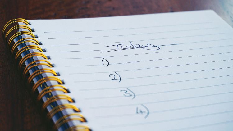 A photo of a journal with the words today and a list from 1 to 4 on it.