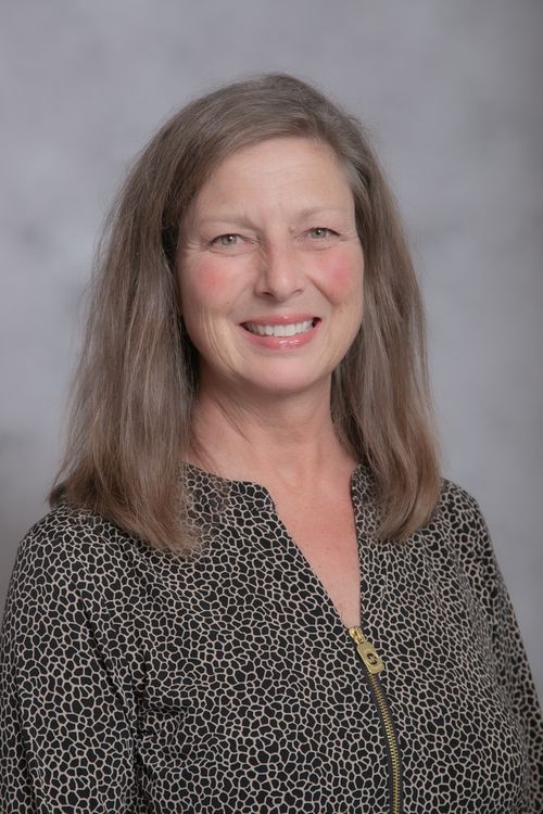 A photo of Rebecca Henne smiling.