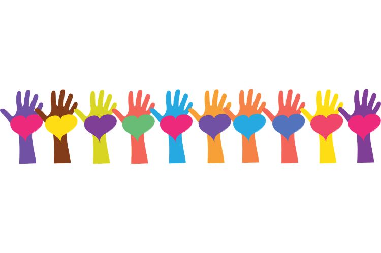 Various colored hands outstretched with various color hearts on the palms.