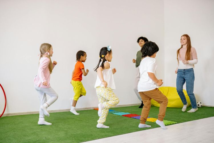 Children exercising together with teachers.