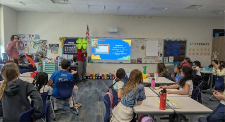 A classroom in Ingham County doing a coding lesson.
