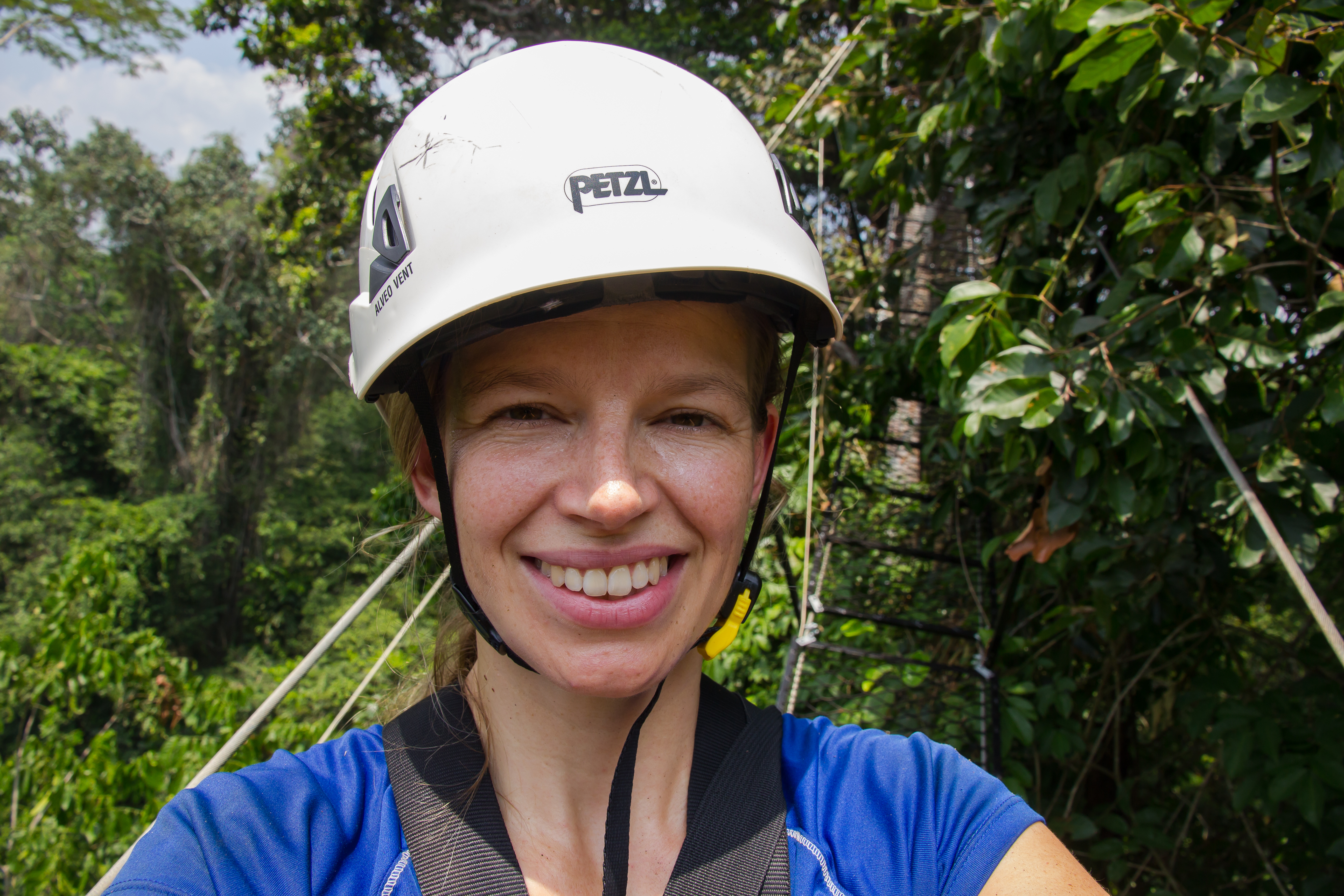 Marielle Smith stands on a canopy walkway, which hangs almost 30 m above the forest floor in the Tapaj&oacute;s National Forest. The walkway provides researchers with easy access to study upper canopy leaves, as well as breath-taking views over the forest. [Photo taken by Marielle N. Smith]