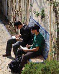 Two students drawing at Alc&aacute;zar de Sevilla, Seville, Spain.