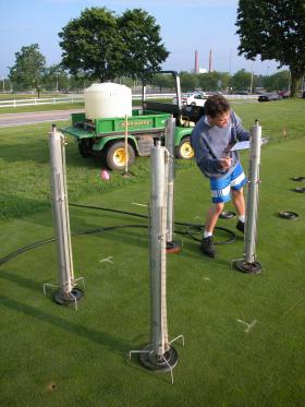 Taking measurements on some turf samples