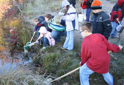 Students gathering samples for an experiment. Students gathering samples for an experiment.