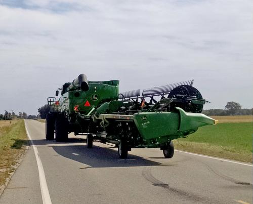 A large gombine driving on the road.